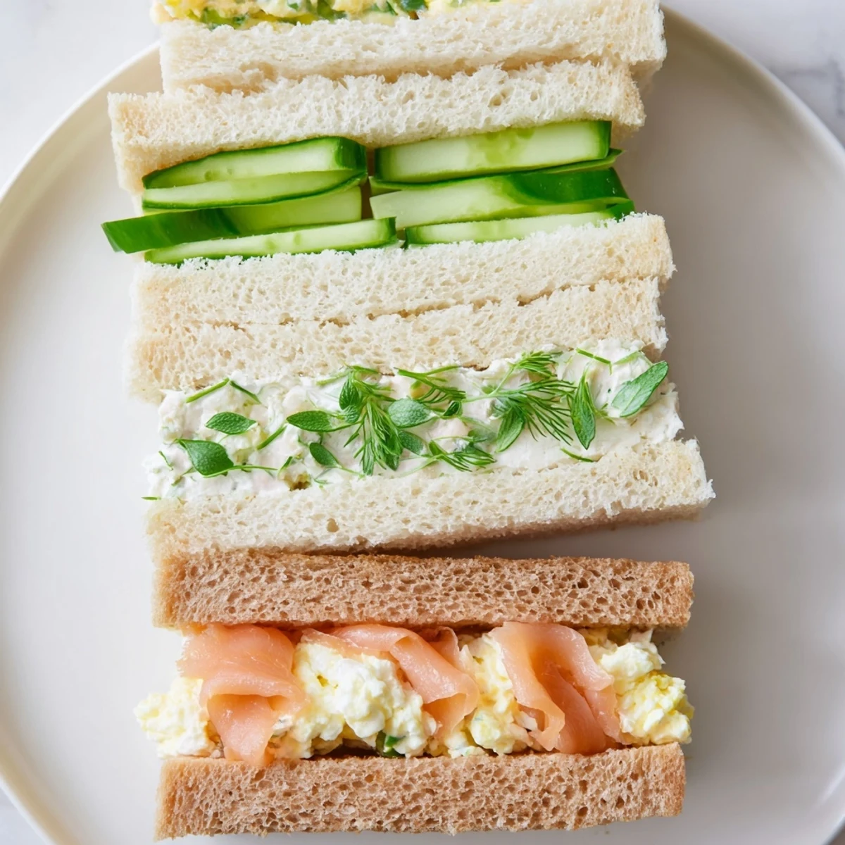 Freshly made Castle Feast Royal Tea Party Sandwiches with crusts removed, ready to be enjoyed with tea.