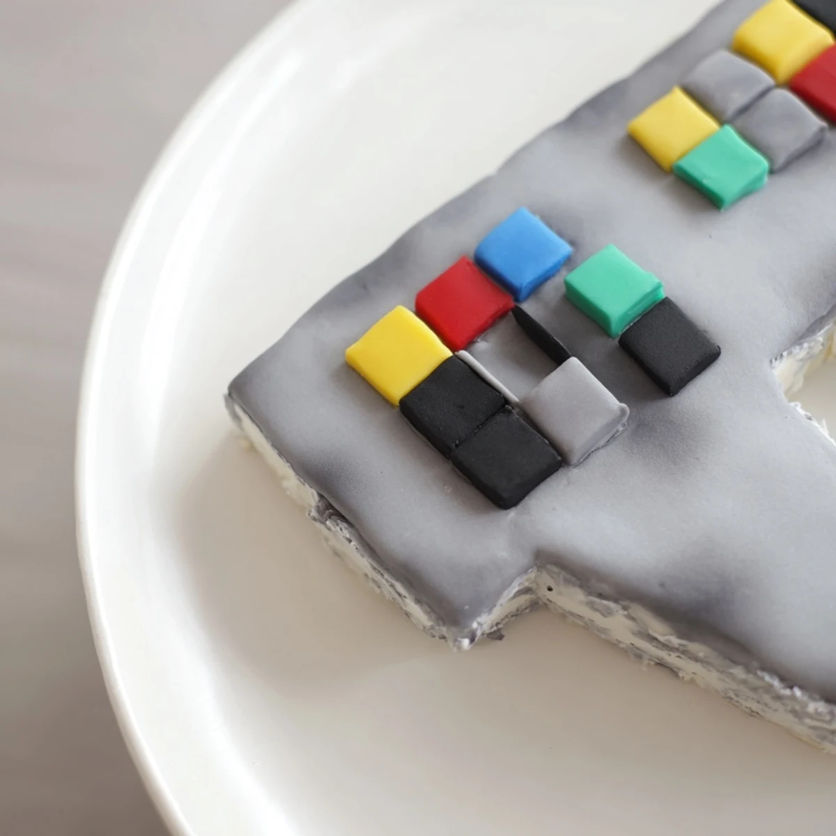 Imagine this delightful Pixel Video Game Controller Cake, layered with vanilla, frosted and beautifully presented on a platter.