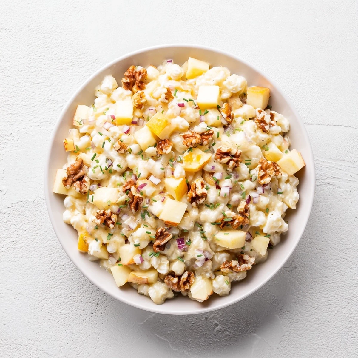 Close-up of a refreshing and colorful Fall Harvest Apple and Chickpea Salad bursting with healthy ingredients.