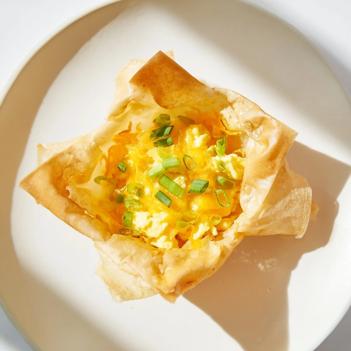 Crispy and flavorful, this Rice Paper Egg & Cheese Fold is served hot with a savory filling.