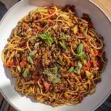 Savory 25-minute Lentil Bolognese with hidden veggies: simmered, aromatic comfort on pasta.