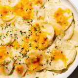 A rich bake of Cheesy Scalloped Potatoes, creamy layers with melted cheddar, Gruyere, excellent as a side.