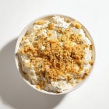 Golden toasted panko crowns this easy, flavorful Fried Pickle Dip served at a snack party.