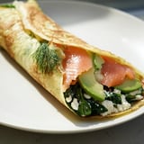 A beautiful, thin Blender-Egg Crepe Wrap filled with colorful avocado and fresh herbs ready to eat.
