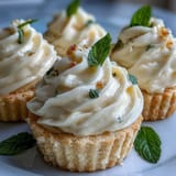 Bright lemon mousse cups with buttery shortbread cookies, perfect for a refreshing and elegant spring dessert.  