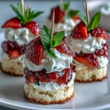 Delicious mini strawberry shortcake bites are perfect for parties, stacked with cream.