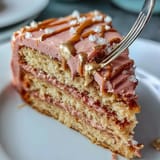 A stunning Bridal Shower Rosé Velvet Cake, glistening with luscious gold drip.
