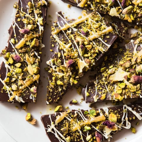 Close up of a Pistachio Dubai Chocolate Bark, showing layers of rich chocolate and crunchy pistachios.
