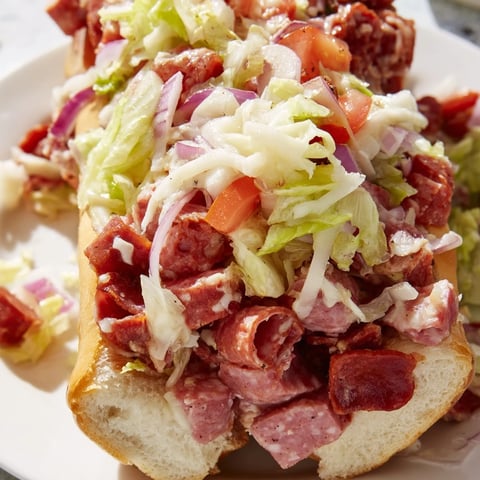 Toasted hoagie rolls packed with chopped salami, pepperoni, and provolone cheese.  