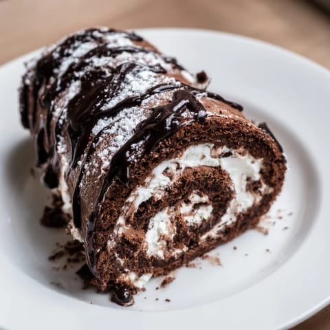 This Winter Warmer dessert board features a chocolate roulade and treats, inviting cozy fireplace sharing.