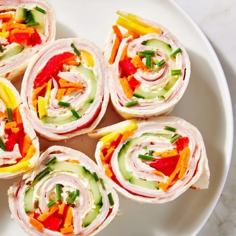 Festive Savory Smoked Turkey Pinwheels, arranged in a Christmas tree shape, bursting with fresh flavors.