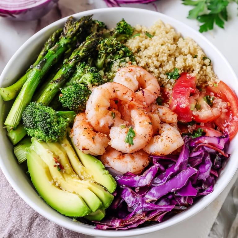 Savory Detox Buddha Bowl with Shrimp and Quinoa, showcasing fresh vegetables, succulent seafood, and a simple olive oil dressing, ideal for an easy weeknight meal.