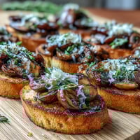 Wild Mushroom & Garlic Crostini with sautéed wild mushrooms and Parmesan on crispy garlic toasts.